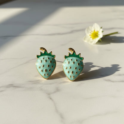 Blue Strawberry Earrings on marble