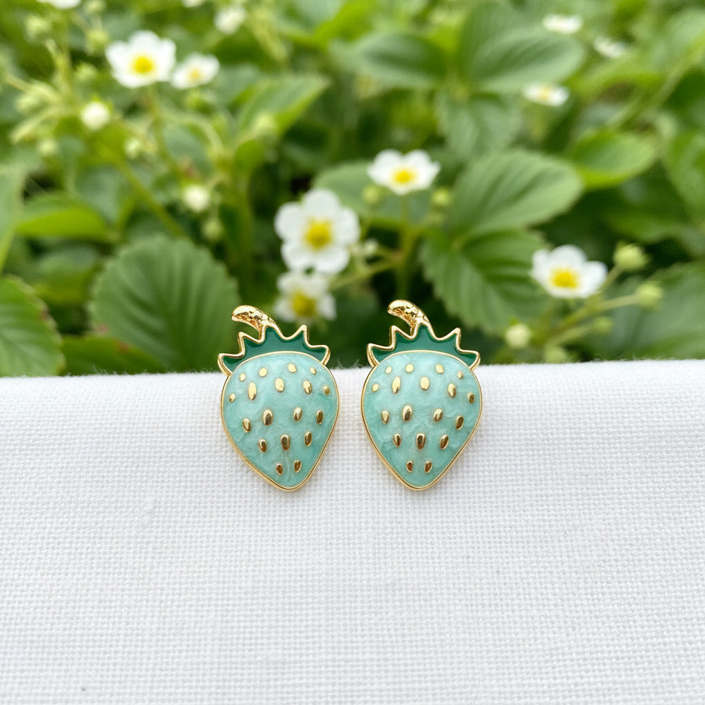 Blue Strawberry Earrings in garden