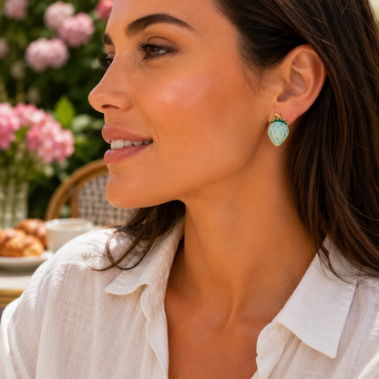 Woman wearing Blue Strawberry Earrings at cafe