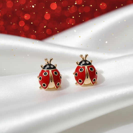 Bold Lucky Ladybug Earrings on a white plate