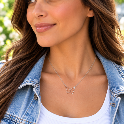 Woman wearing butterfly necklace