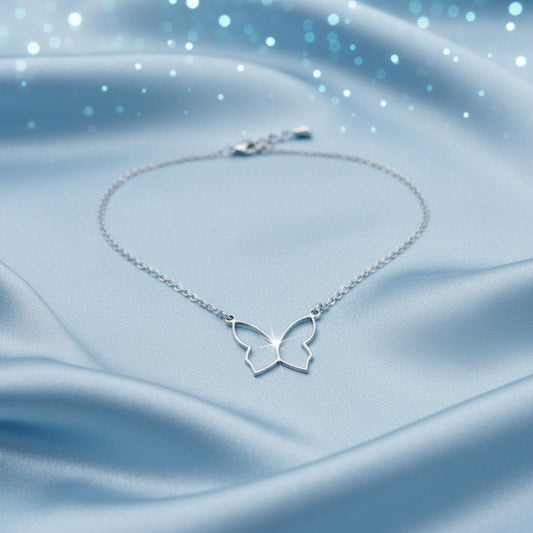 Butterfly Silver Necklace on a blue fabric background