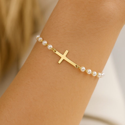 Gold Cross Pearl Bracelet/Anklet on a wrist against a neutral background