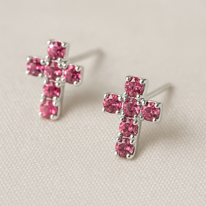 Pink Rhinestone Cross Earrings on a beige background