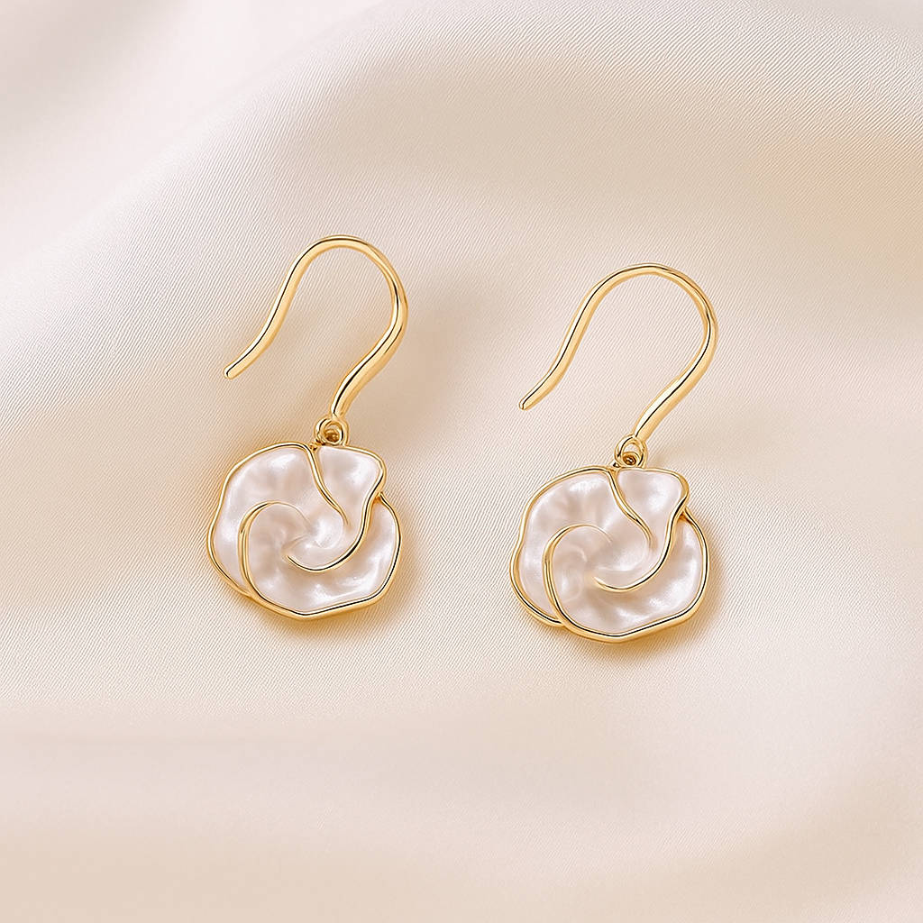 Golden Edge Pearl Drop Earrings on a beige background