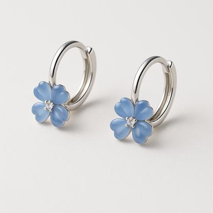 Blue Flower Petal Hoop Earrings on a light gray background