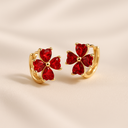 Ruby Red Flower Petal Hoop Earrings on a beige background