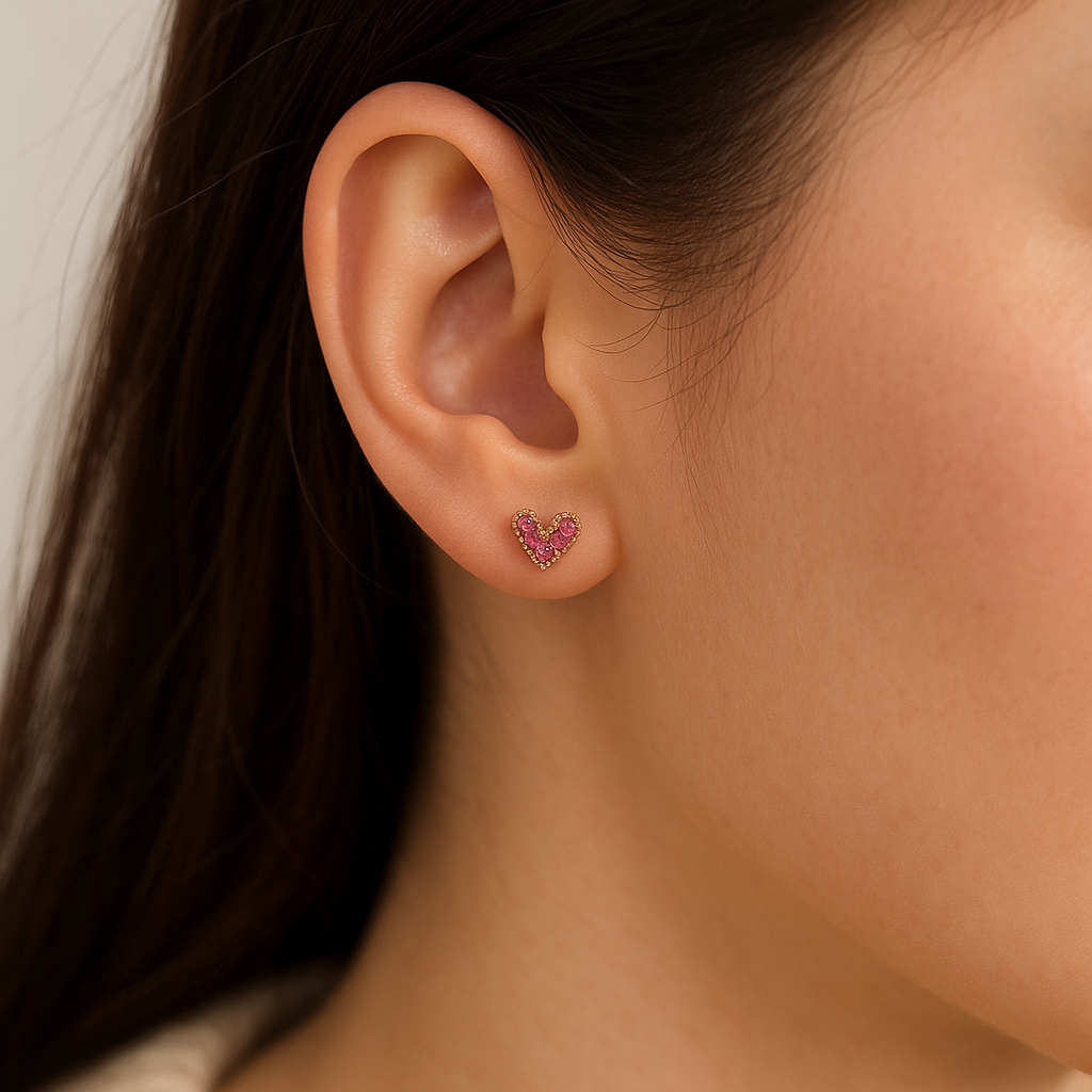 Petite Pink Zircon Heart Earrings with a neutral background