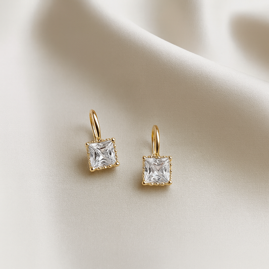 Classic Square Zircon Drop Earrings on a beige fabric background