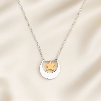 Silver Moon Gold Star Necklace pendant on a beige background