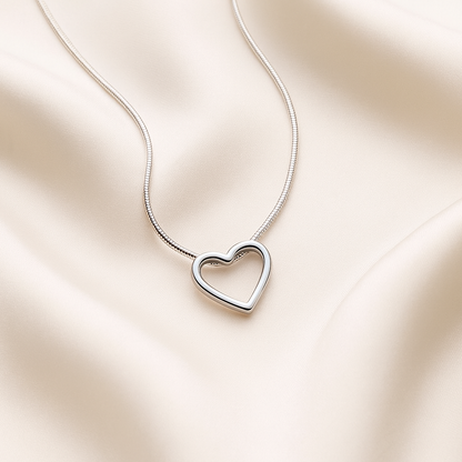 Sterling Silver Open Heart Necklace against a soft beige background
