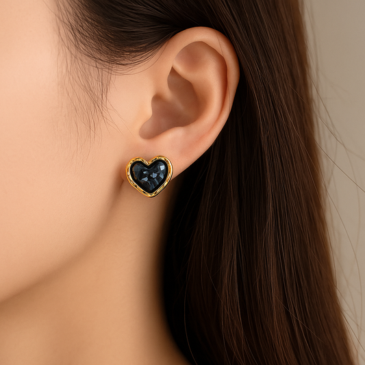 Midnight Mosaic Black & Gold Heart Earrings worn by a person