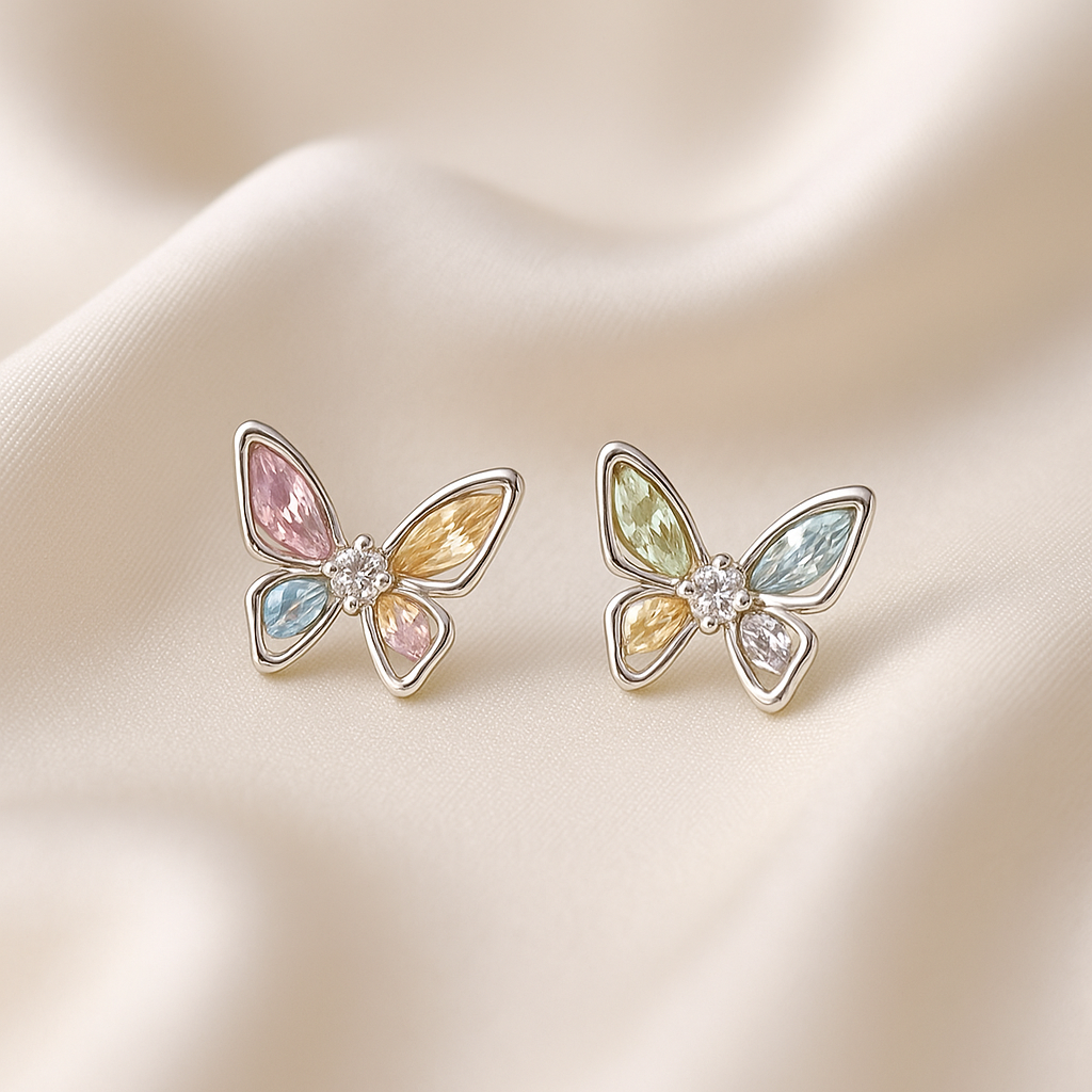 Pastel Crystal Butterfly Earrings with pastel colors on a soft beige background
