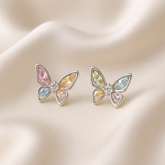 Pastel Crystal Butterfly Earrings with pastel colors on a soft beige background