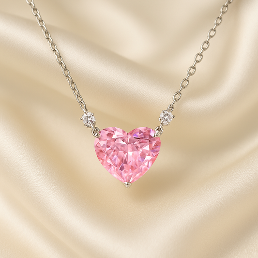 Pink Zirconia Heart Necklace on a beige fabric background