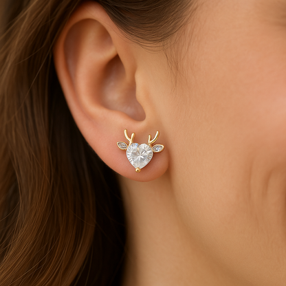 Close-up of an woman wearing a Gold Reindeer Zircon Heart Earrings with deer antlers.