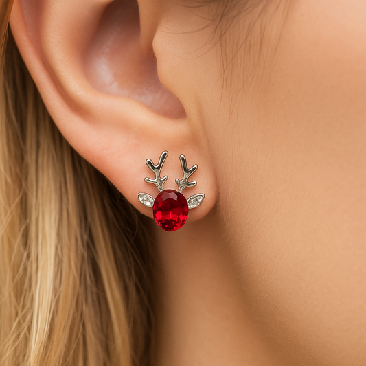 Ruby Reindeer Earrings worn on an ear