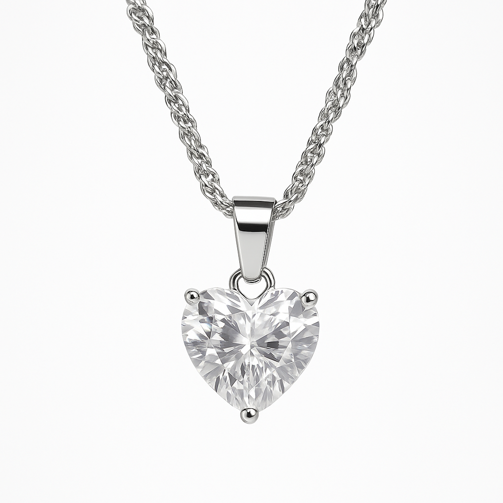 Heart-shaped diamond pendant on a silver chain against a white background