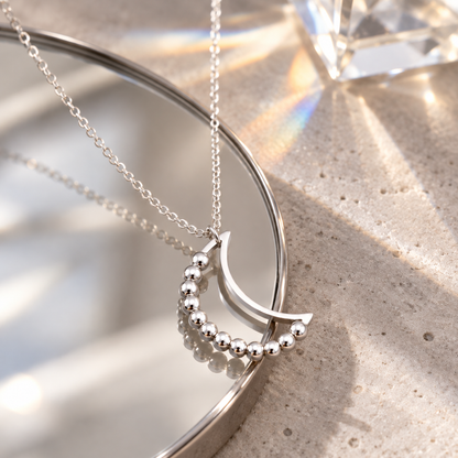 Silver Beaded Crescent Moon Spinner Necklace