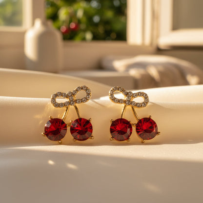 Cherry Bow Pavé Earrings cherry tree in background