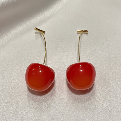Coral Cherry Drop Earrings on a light gray background