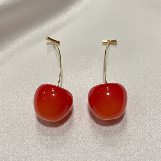 Coral Cherry Drop Earrings on a light gray background