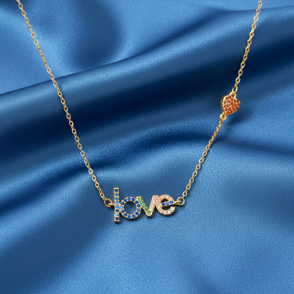 Love Heart Necklace with 'love' pendant on a blue satin background