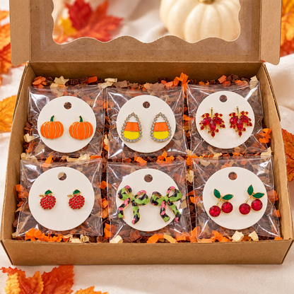 An open kraft gift box containing the Fall Fun 6-Pair Earring Gift Bundle