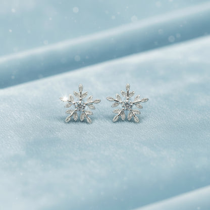 Frosted Crystal Snowflake Earrings on light blue velvet