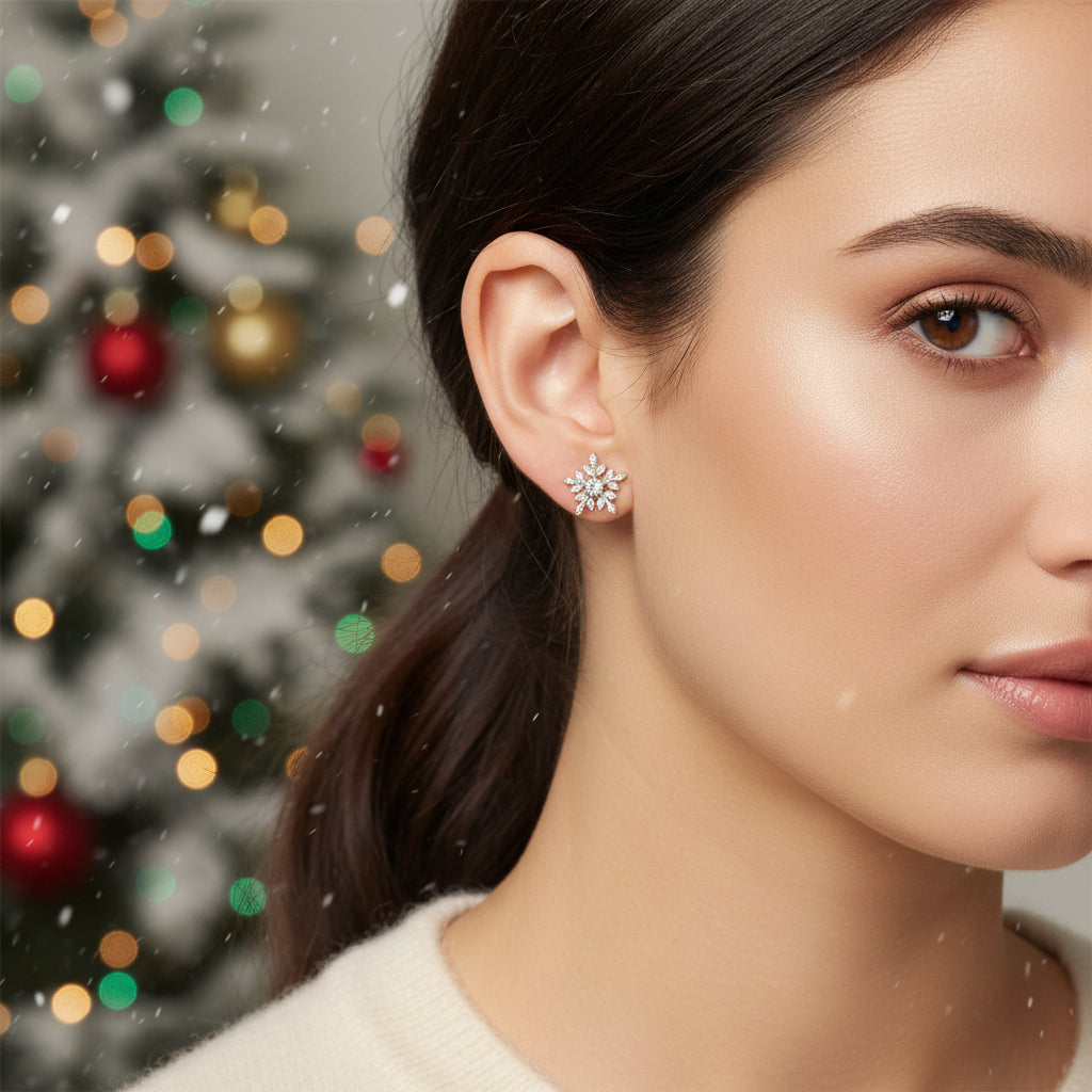 Woman wearing Frosted Crystal Snowflake Earrings in front of tree