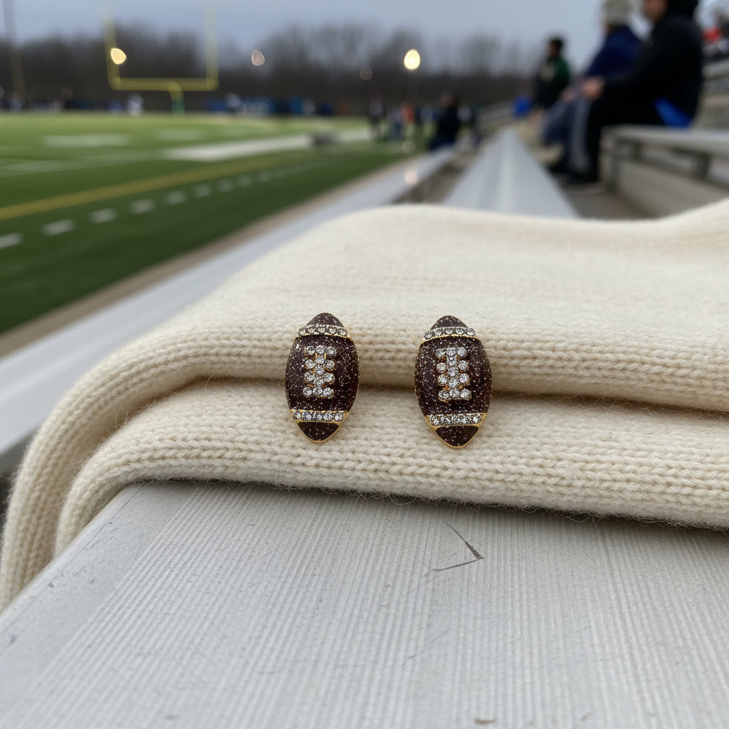 Game Day Sparkle Football Earrings on bleachers