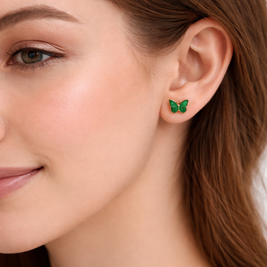 Close-up of a woman wearing Garden Green Butterfly Earrings.