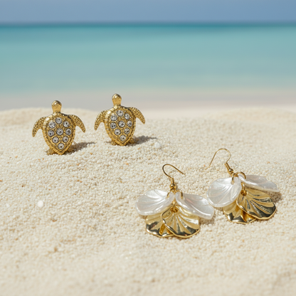 Gold Pavé Sea Turtle & White Gold Seashell Earring Set on beach