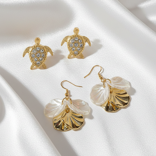Gold Pavé Sea Turtle & White Gold Seashell Earring Set on a white background