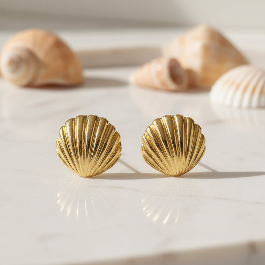 Gold Seashell Statement Earrings on a light background