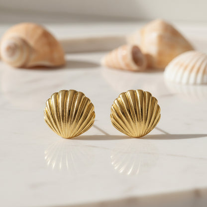 Gold Seashell Statement Earrings on a light background