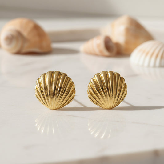 Gold Seashell Statement Earrings on a light background