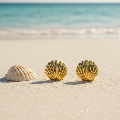 Gold Seashell Statement Earrings on a beach