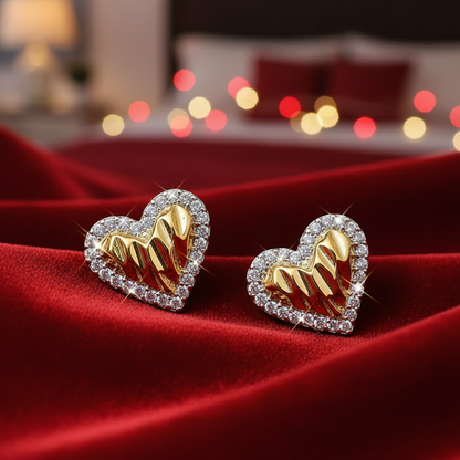 Gold Shimmer Heart Earrings with diamonds on a red fabric background