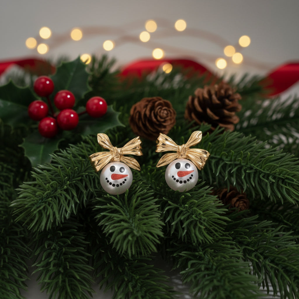 Golden Bow Snowman Earrings on pine
