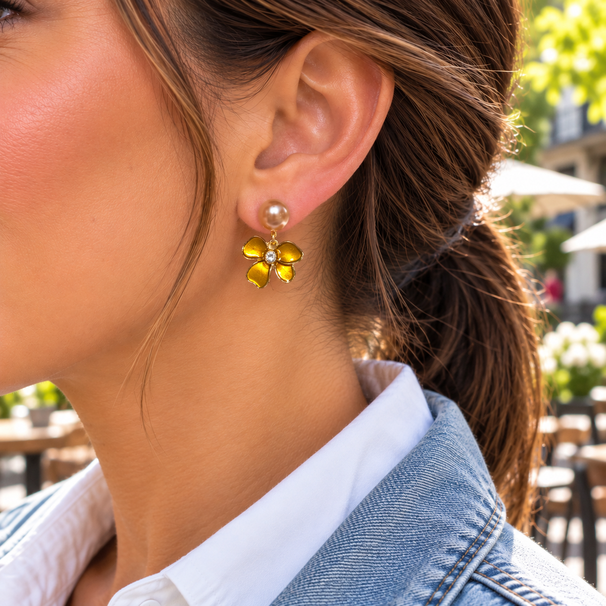 Woman wearing Golden Amber Pearl Flower Earrings with denim