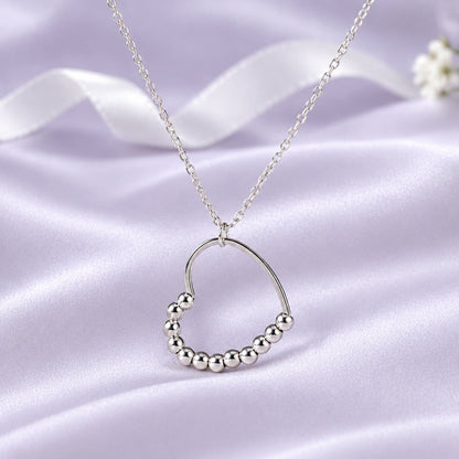 Silver Beaded Heart Spinner Necklace