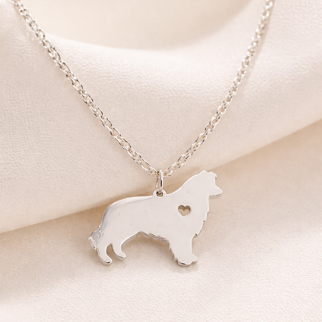 Silver Heartfelt Pup Silhouette Necklace on a light beige background