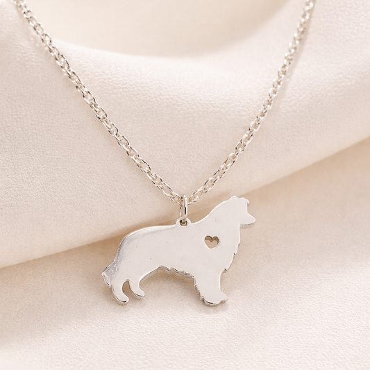 Silver Heartfelt Pup Silhouette Necklace on a light beige background