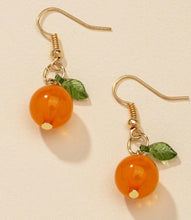 Load image into Gallery viewer, Gold-tone orange slice dangle earrings with enamel finish and small white flower detail