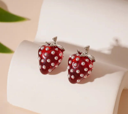 Strawberry Pearl Earrings: Strawberry-shaped earrings with pearl details on a white surface