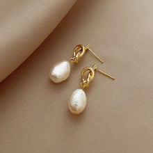 Load image into Gallery viewer, Gold knot drop earrings with classic pearl accents, elegant dangle style