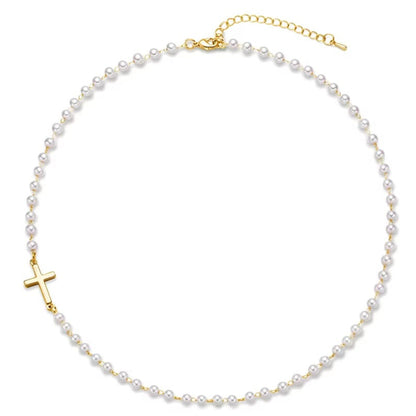 Gold Cross Pearl Necklace with a gold cross pendant on a white background