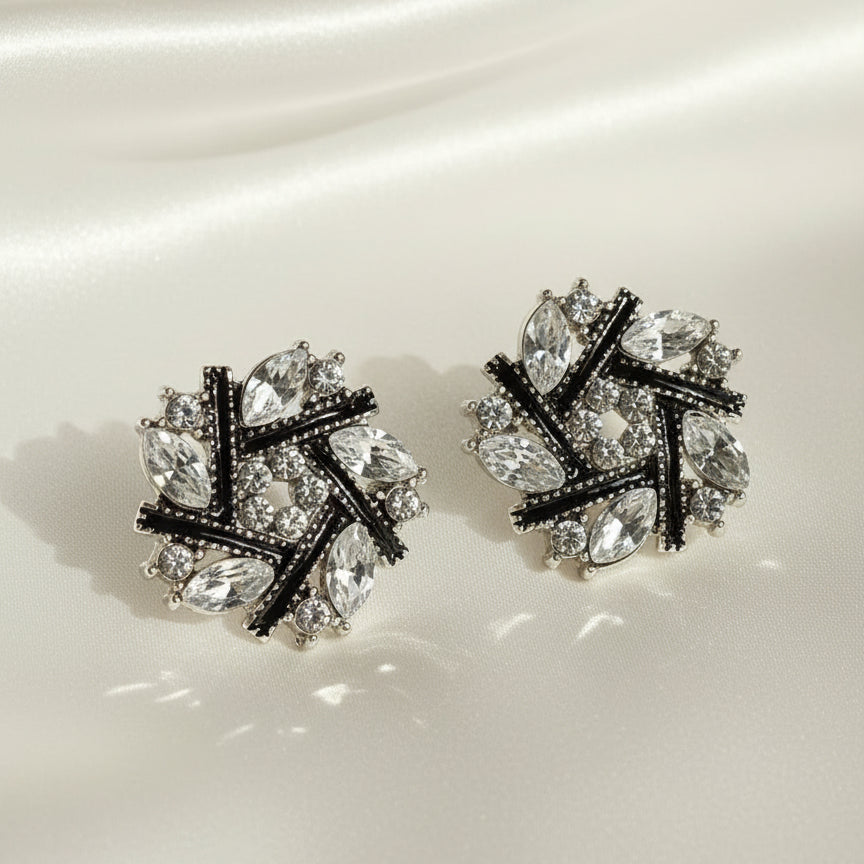 Midnight Silver & Black Crystal Snowburst Earrings with a gray background