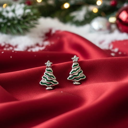 Mini Christmas Tree Stud Earrings on a red fabric with a festive background